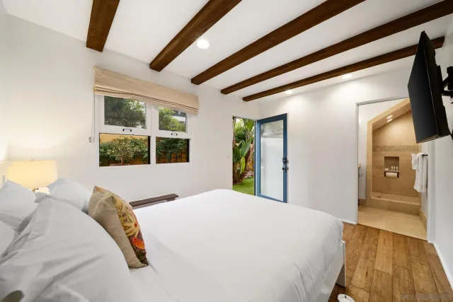 a view of a outdoor space with furniture and city view