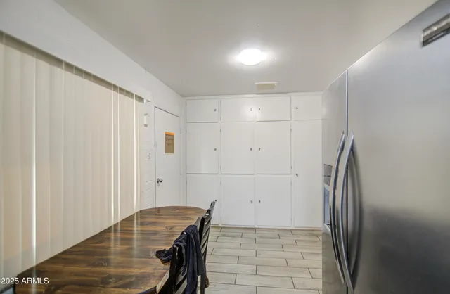 a bedroom with bed and a window