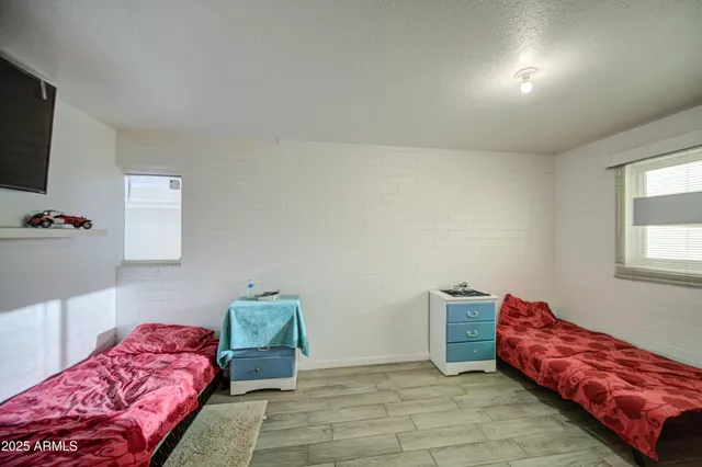 a bathroom with a sink toilet vanity and shower