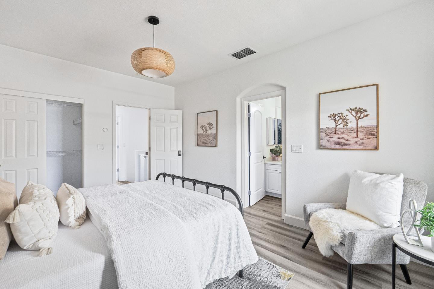 827 Harmony Place Milpitas, CA 95035 - Photo 14 of 36 a spacious bedroom with a bed and a chandelier