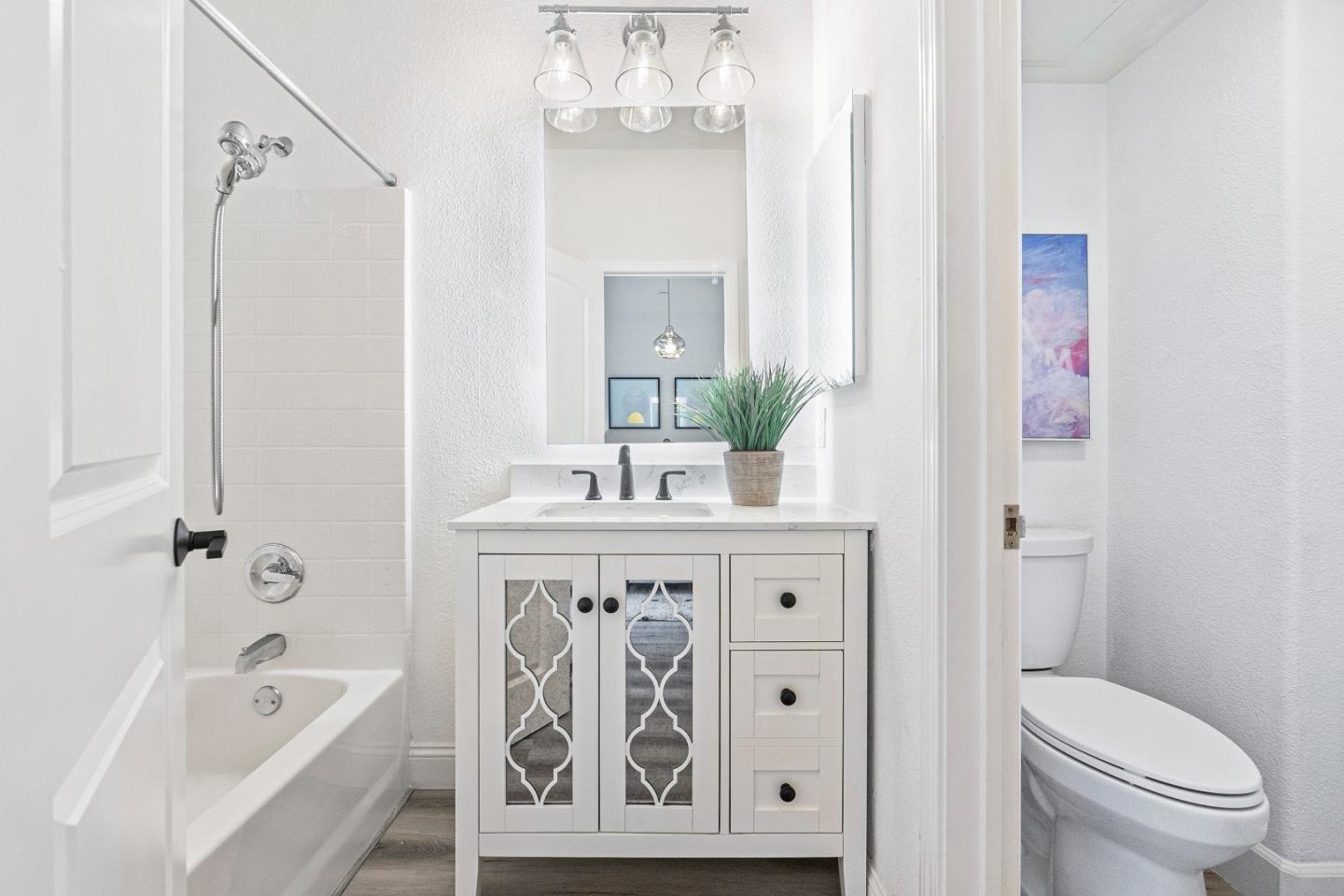 827 Harmony Place Milpitas, CA 95035 - Photo 18 of 36 a spacious bathroom with a granite countertop sink a toilet and shower