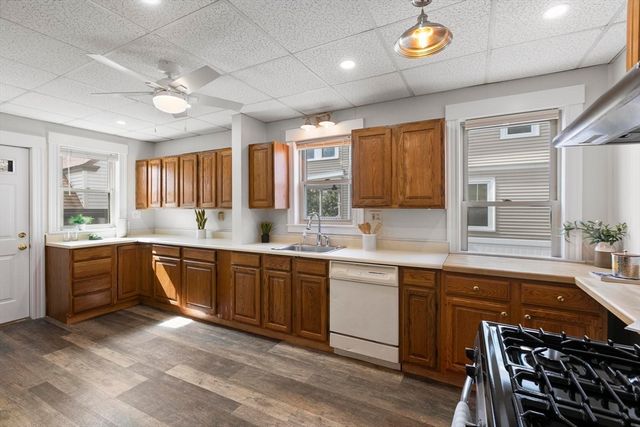 a large kitchen with a large window