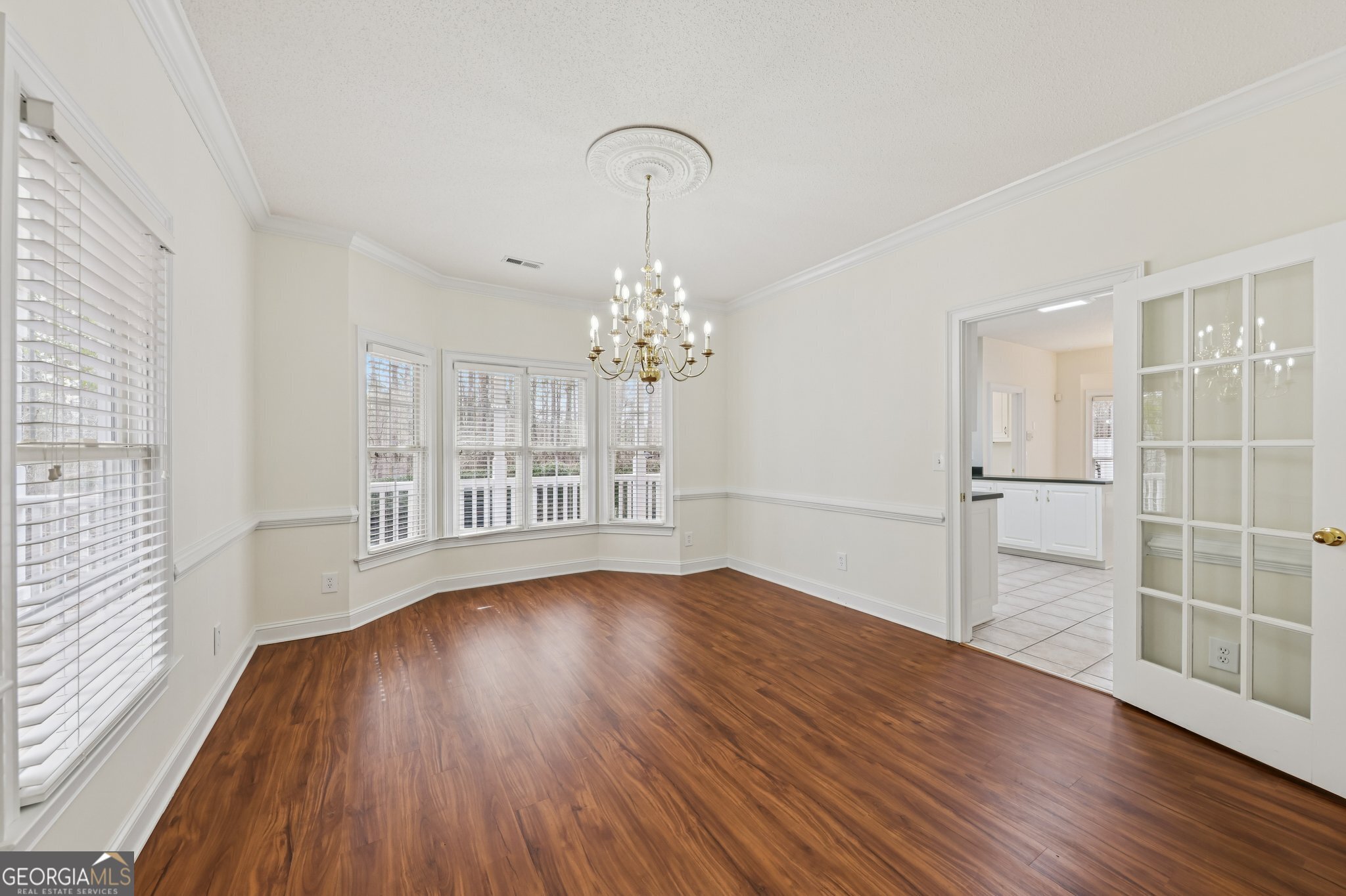 378 Pierce Chapel Road Newnan, GA 30263 - Photo 17 of 66 wooden floor in an empty room with a window