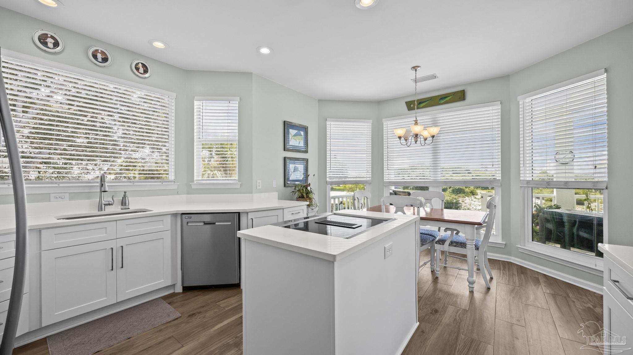 32580 Sandpiper Drive Orange Beach, AL 36561 - Photo 14 of 52 a kitchen with a sink stove and cabinets