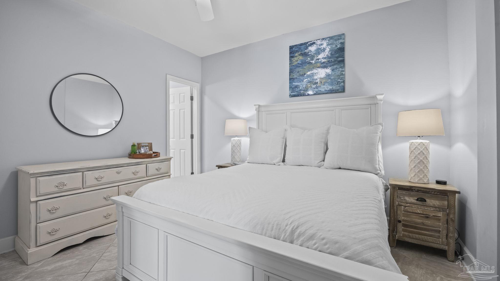 32580 Sandpiper Drive Orange Beach, AL 36561 - Photo 30 of 52 a bedroom with a bed and dresser