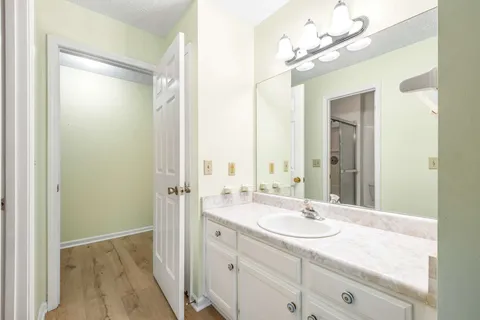 a bathroom with a sink double vanity and a mirror