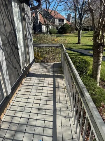 a view of a chairs and table in patio
