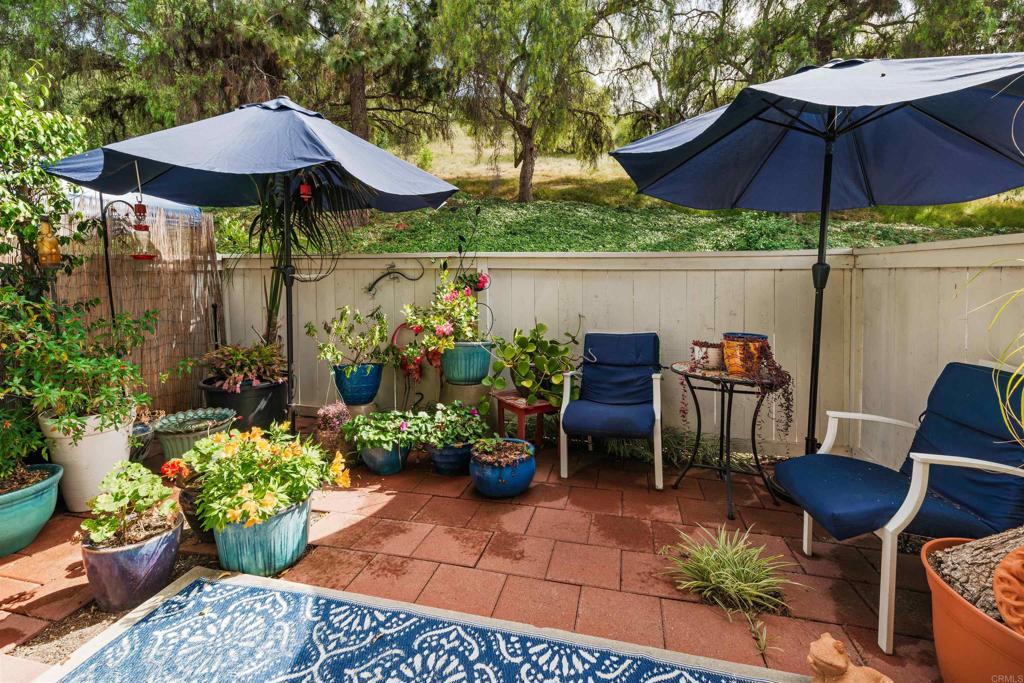4239 Vista Del Rio Way, Unit 6 Oceanside, CA 92057 - Photo 15 of 30 a view of a patio with furniture and a garden