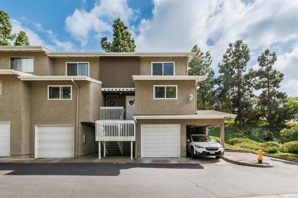 4239 Vista Del Rio Way, Unit 6 Oceanside, CA 92057 - Photo 4 of 30 a view of a car park in front of house