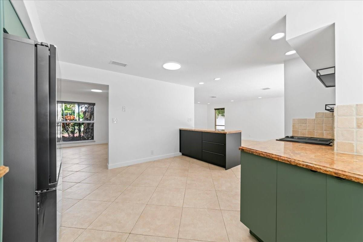 8600 Gatehouse Road Plantation, FL 33324 - Photo 12 of 27 a view of a kitchen with a sink and a refrigerator