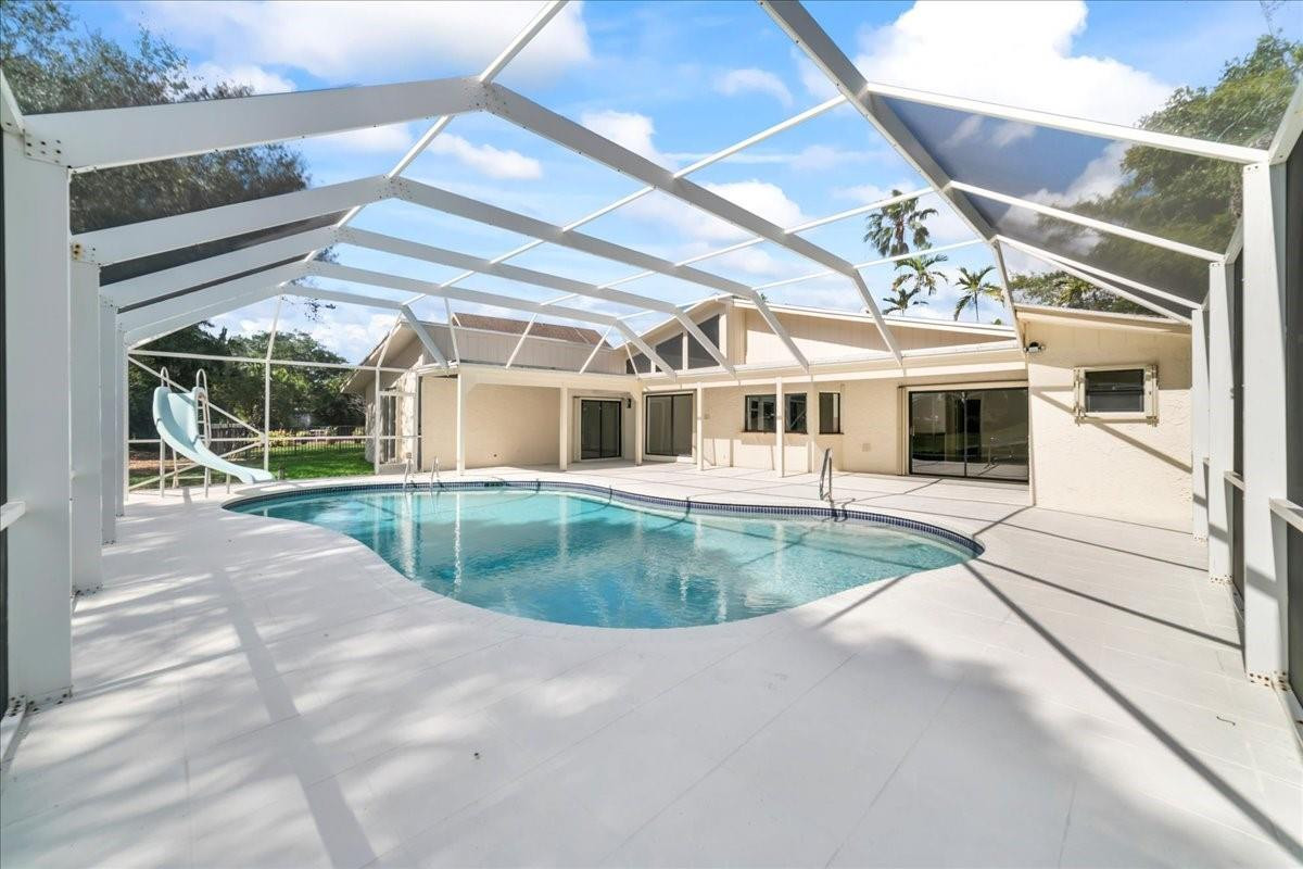 8600 Gatehouse Road Plantation, FL 33324 - Photo 16 of 27 a view of a house with a backyard