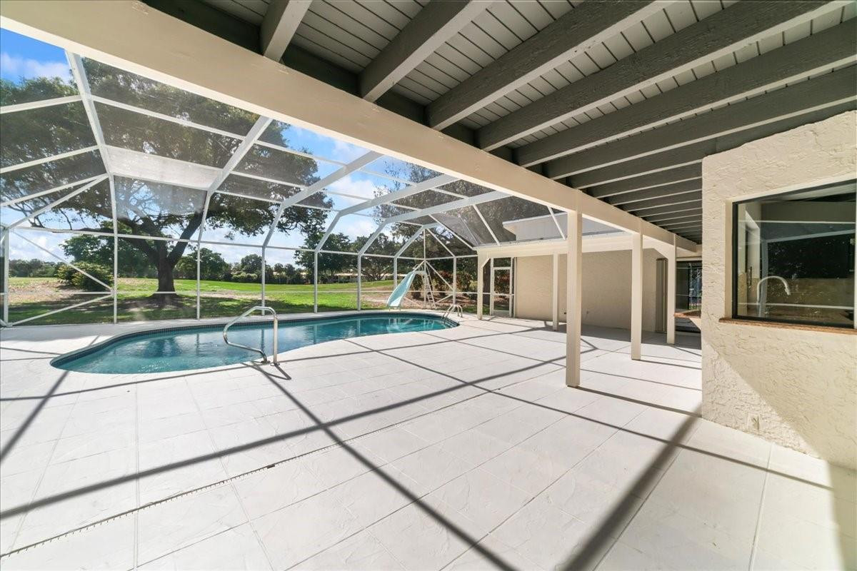 8600 Gatehouse Road Plantation, FL 33324 - Photo 18 of 27 a view of a house with a backyard and a patio