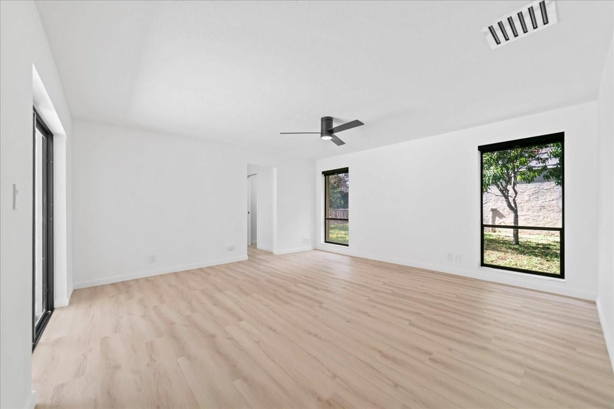 8600 Gatehouse Road Plantation, FL 33324 - Photo 19 of 27 wooden floor in an empty room with a window