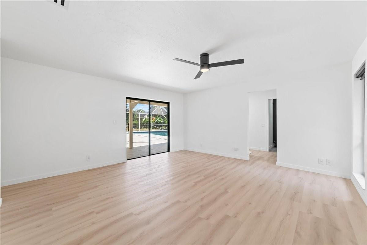 8600 Gatehouse Road Plantation, FL 33324 - Photo 20 of 27 a view of an empty room with wooden floor and a window