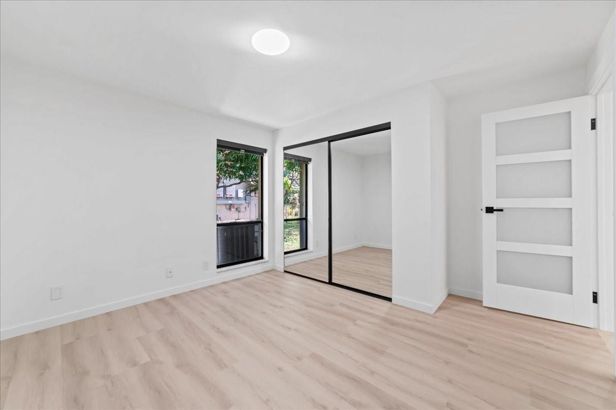 8600 Gatehouse Road Plantation, FL 33324 - Photo 23 of 27 an empty room with closet and windows