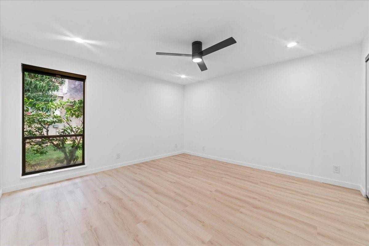 8600 Gatehouse Road Plantation, FL 33324 - Photo 25 of 27 an empty room with a window and a ceiling fan