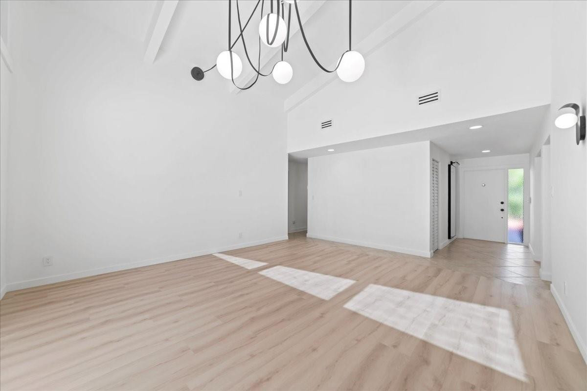 8600 Gatehouse Road Plantation, FL 33324 - Photo 7 of 27 a view of an empty room with wooden floor