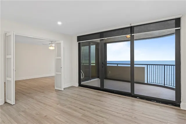 a view of a park with a multi story residential apartment building in the background