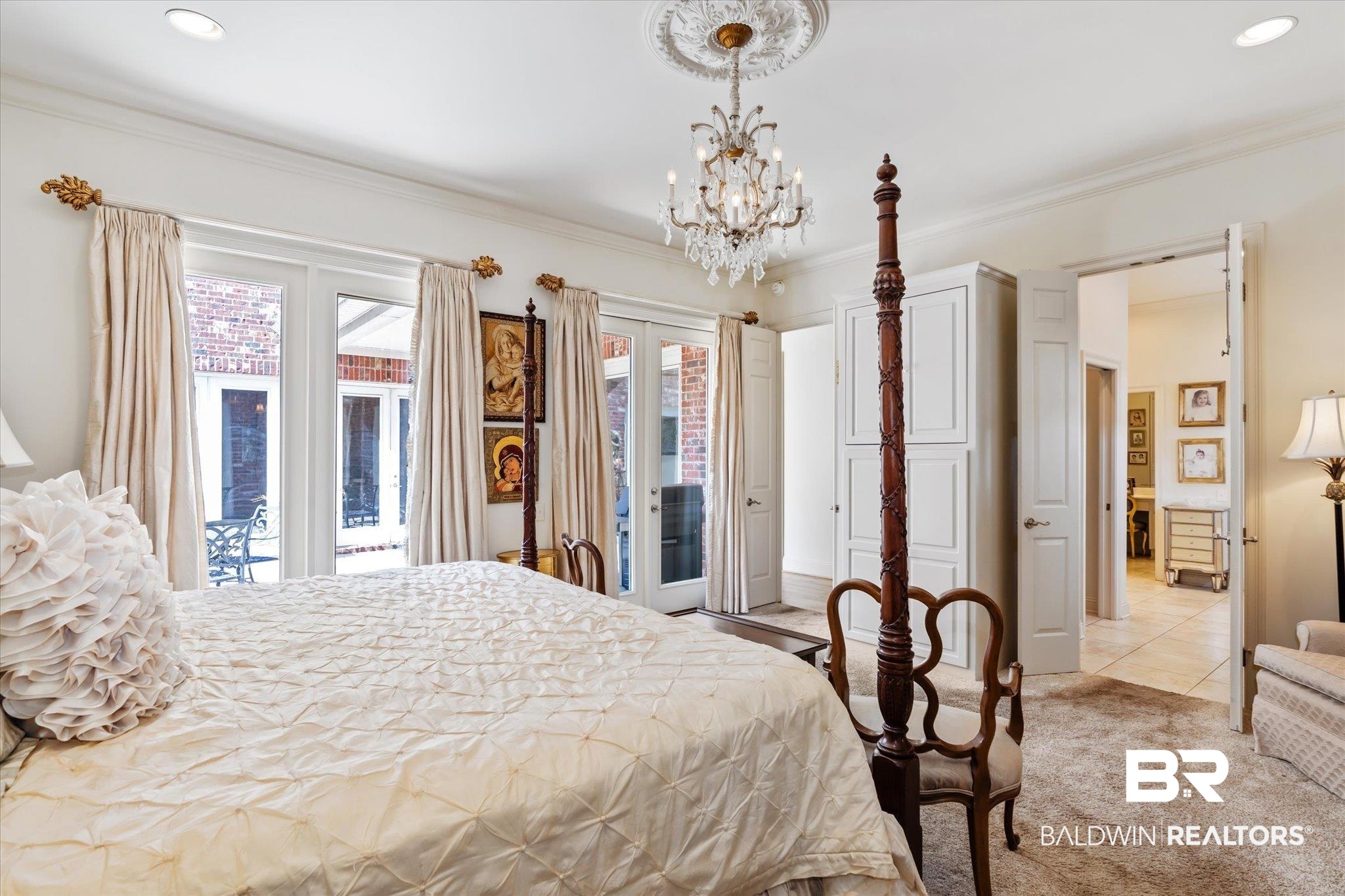3963 Wimbledon Park Mobile, AL 36608 - Photo 23 of 51 Carpeted bedroom with access to outside, an inviting chandelier, ornamental molding, and multiple windows
