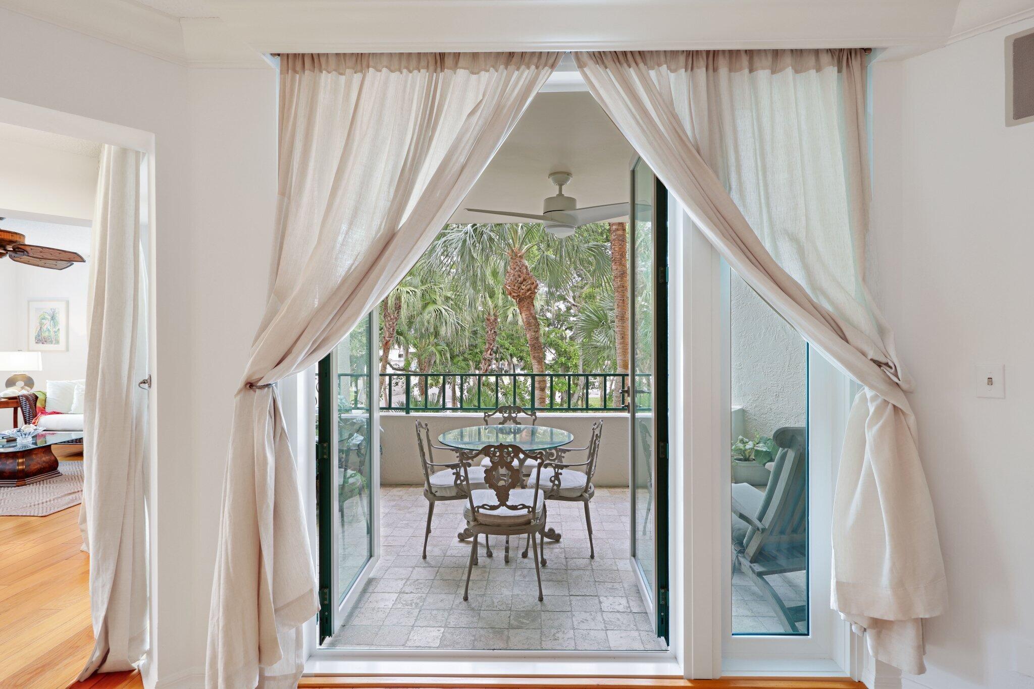 100 Southeast 5th Avenue, Unit 308 Boca Raton, FL 33432 - Photo 15 of 49 a view of a room with a large window and chairs