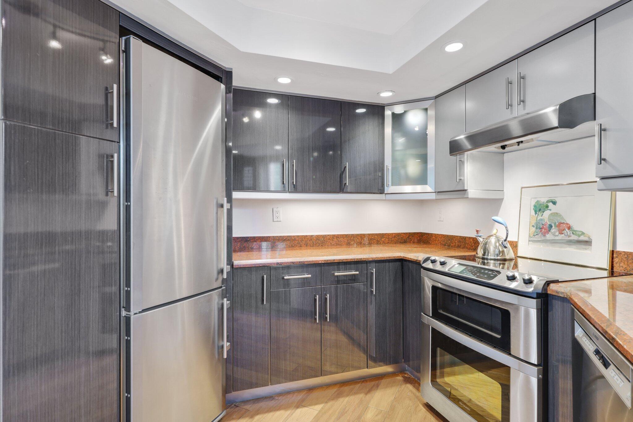 100 Southeast 5th Avenue, Unit 308 Boca Raton, FL 33432 - Photo 25 of 49 a kitchen with stainless steel appliances a refrigerator and a sink