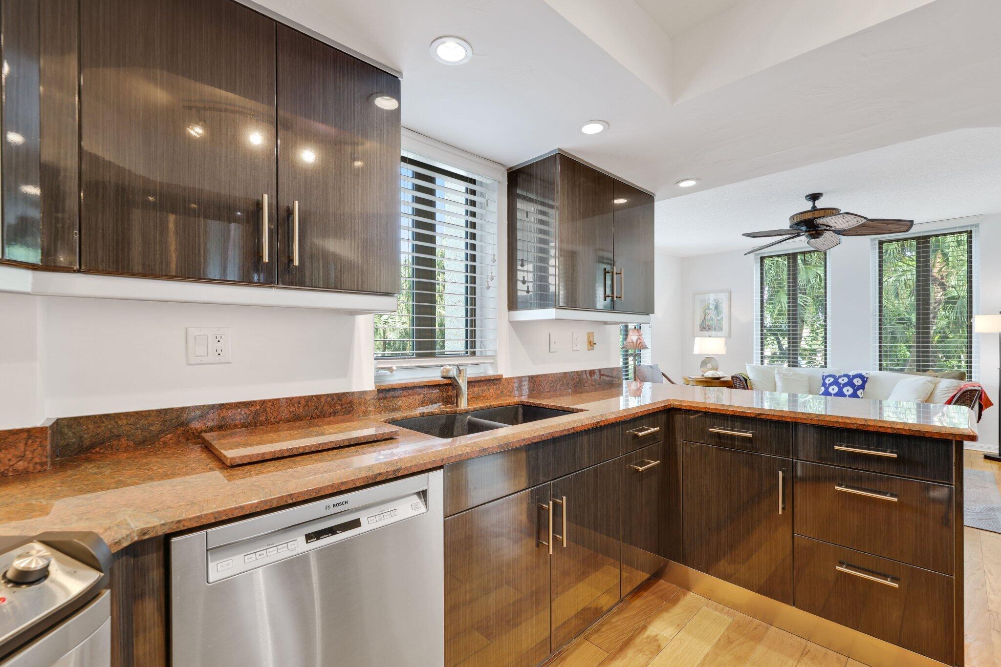 100 Southeast 5th Avenue, Unit 308 Boca Raton, FL 33432 - Photo 26 of 49 a kitchen with a sink and a stove