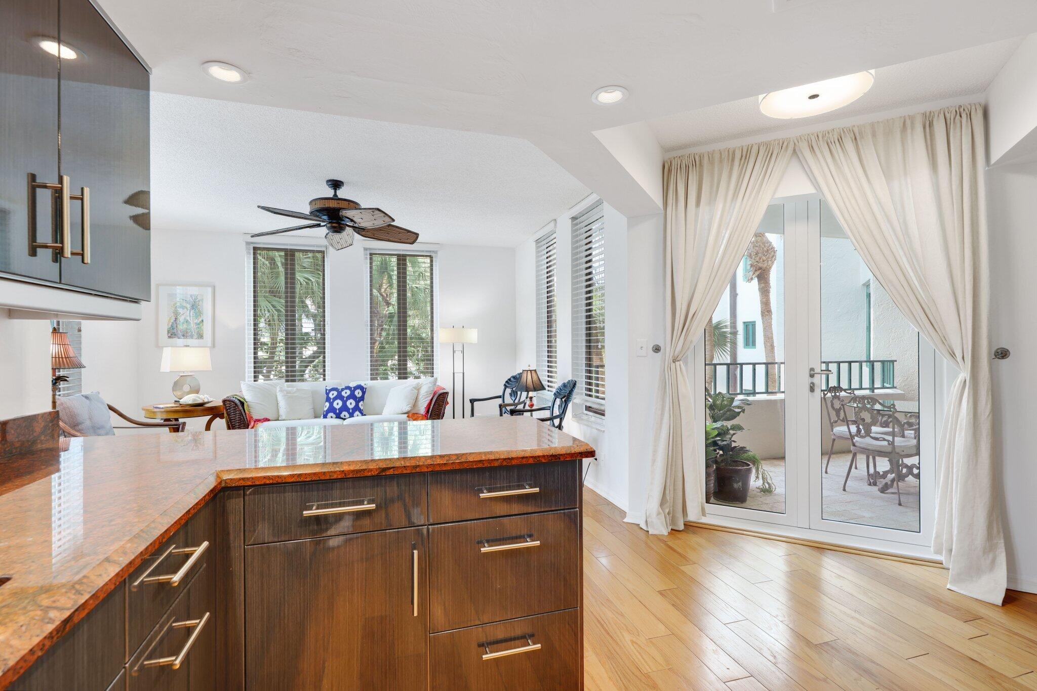 100 Southeast 5th Avenue, Unit 308 Boca Raton, FL 33432 - Photo 27 of 49 a kitchen with a sink appliances and cabinets