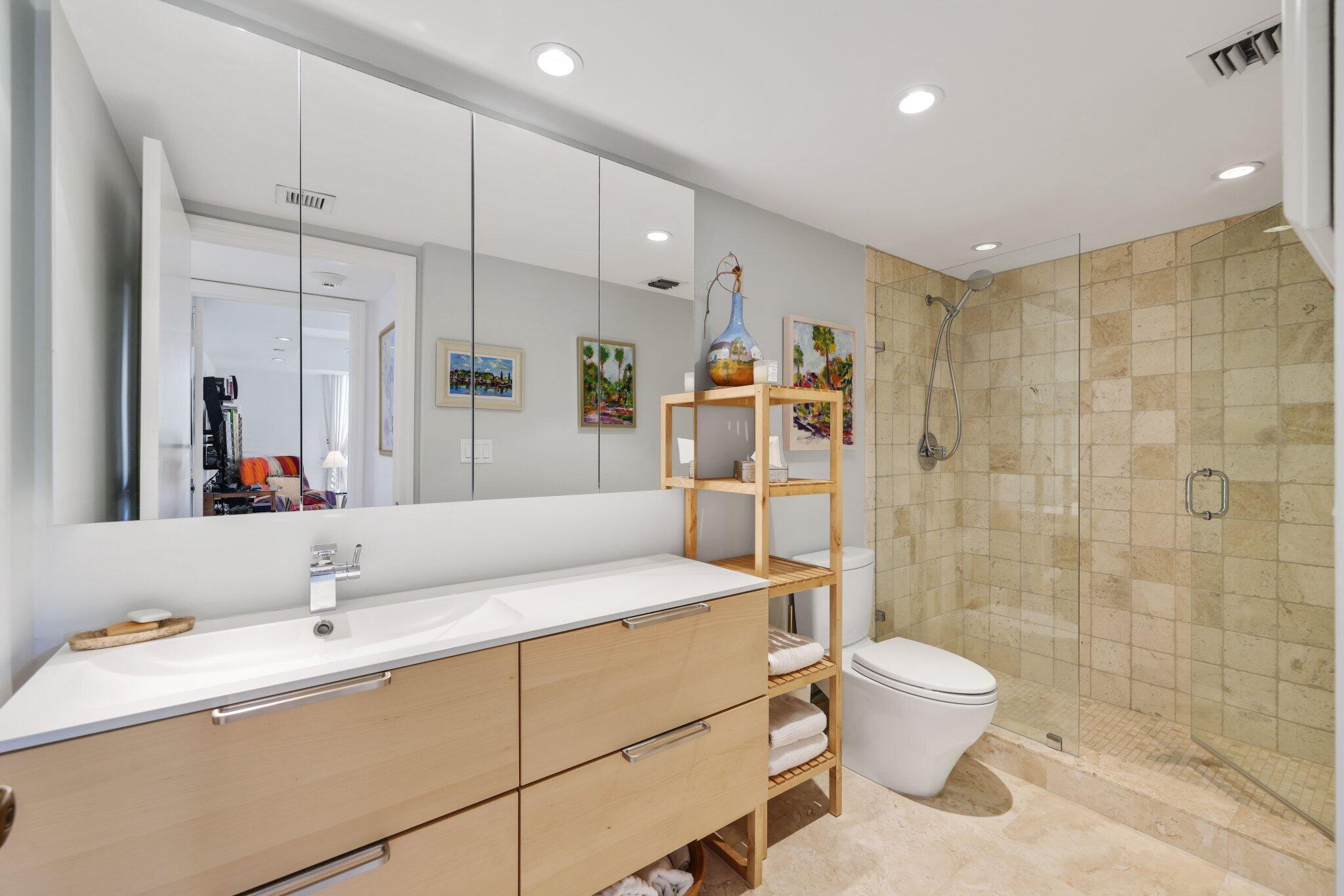 100 Southeast 5th Avenue, Unit 308 Boca Raton, FL 33432 - Photo 33 of 49 a spacious bathroom with a sink a toilet and shower