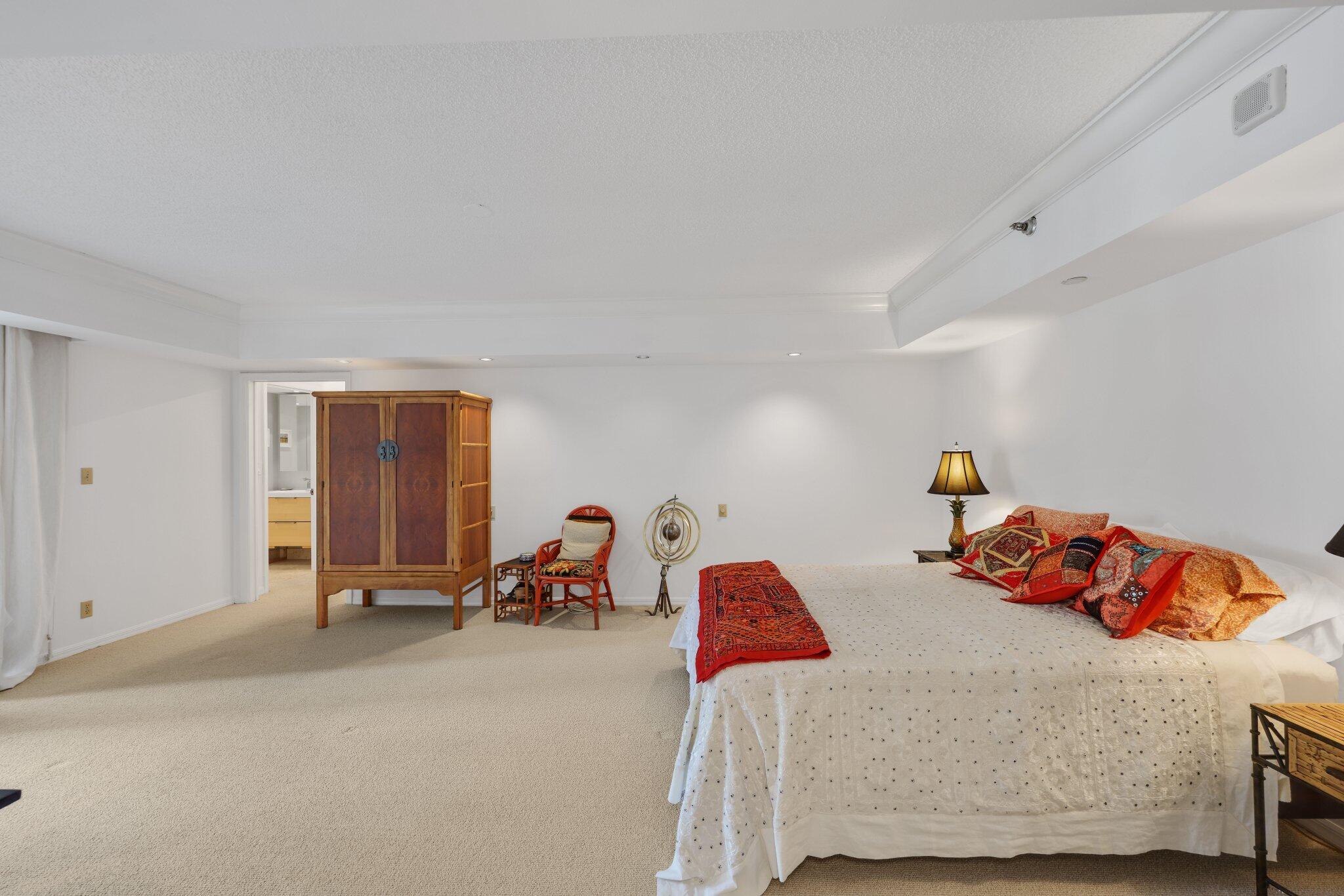 100 Southeast 5th Avenue, Unit 308 Boca Raton, FL 33432 - Photo 38 of 49 a bed room with a bed and a couch