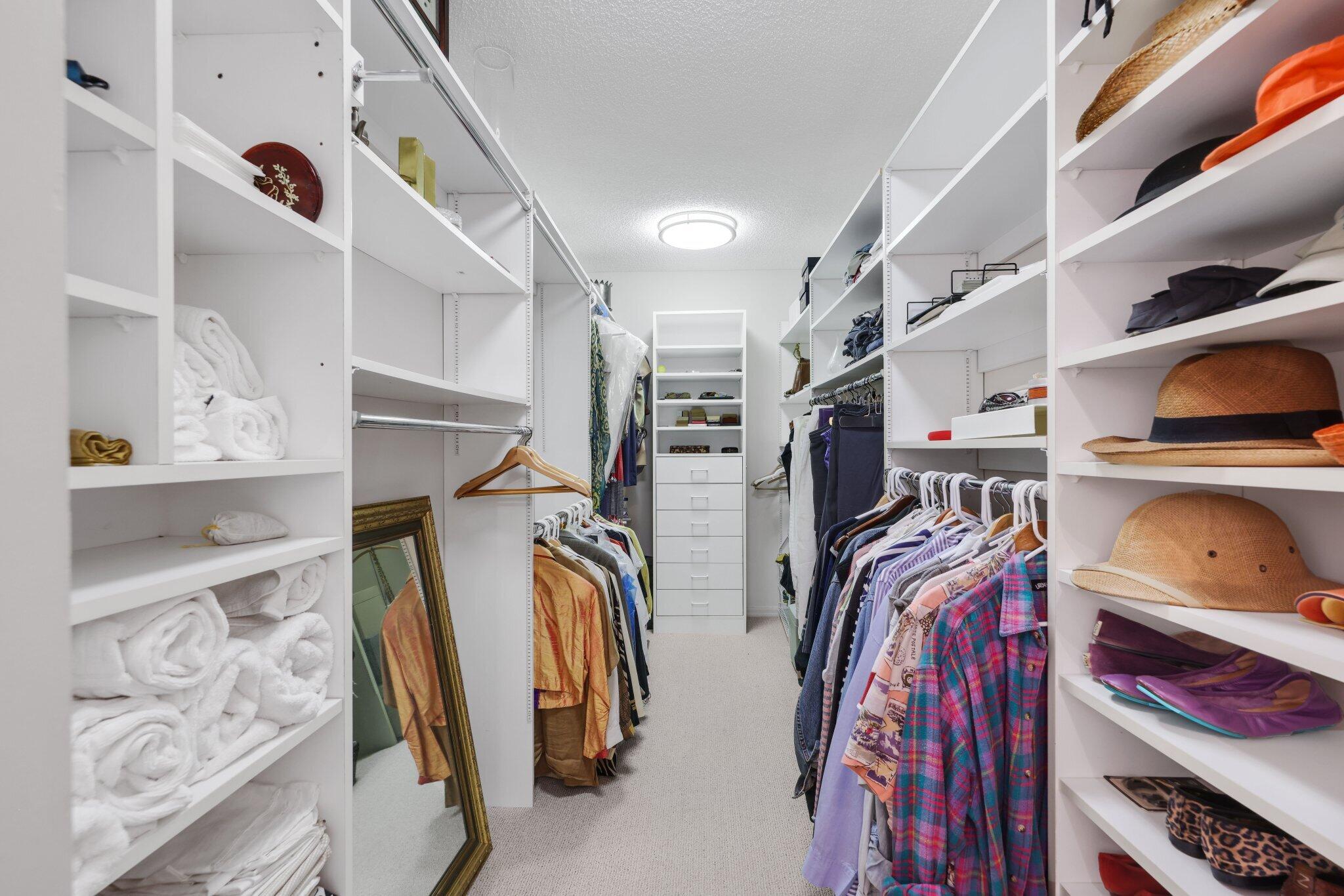 100 Southeast 5th Avenue, Unit 308 Boca Raton, FL 33432 - Photo 42 of 49 a view of walk in closet with clothes and shoes