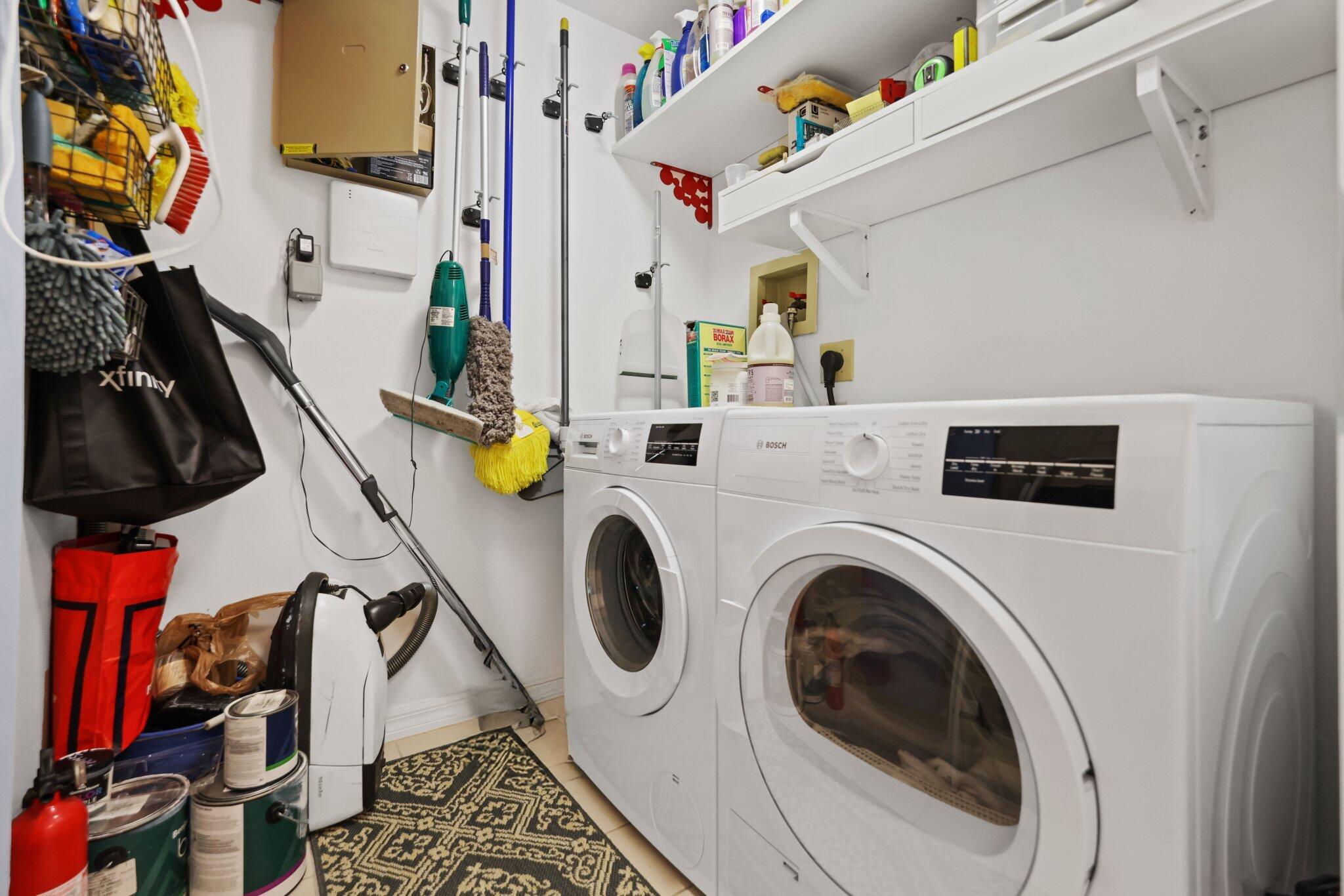 100 Southeast 5th Avenue, Unit 308 Boca Raton, FL 33432 - Photo 46 of 49 a utility room with dryer and washer