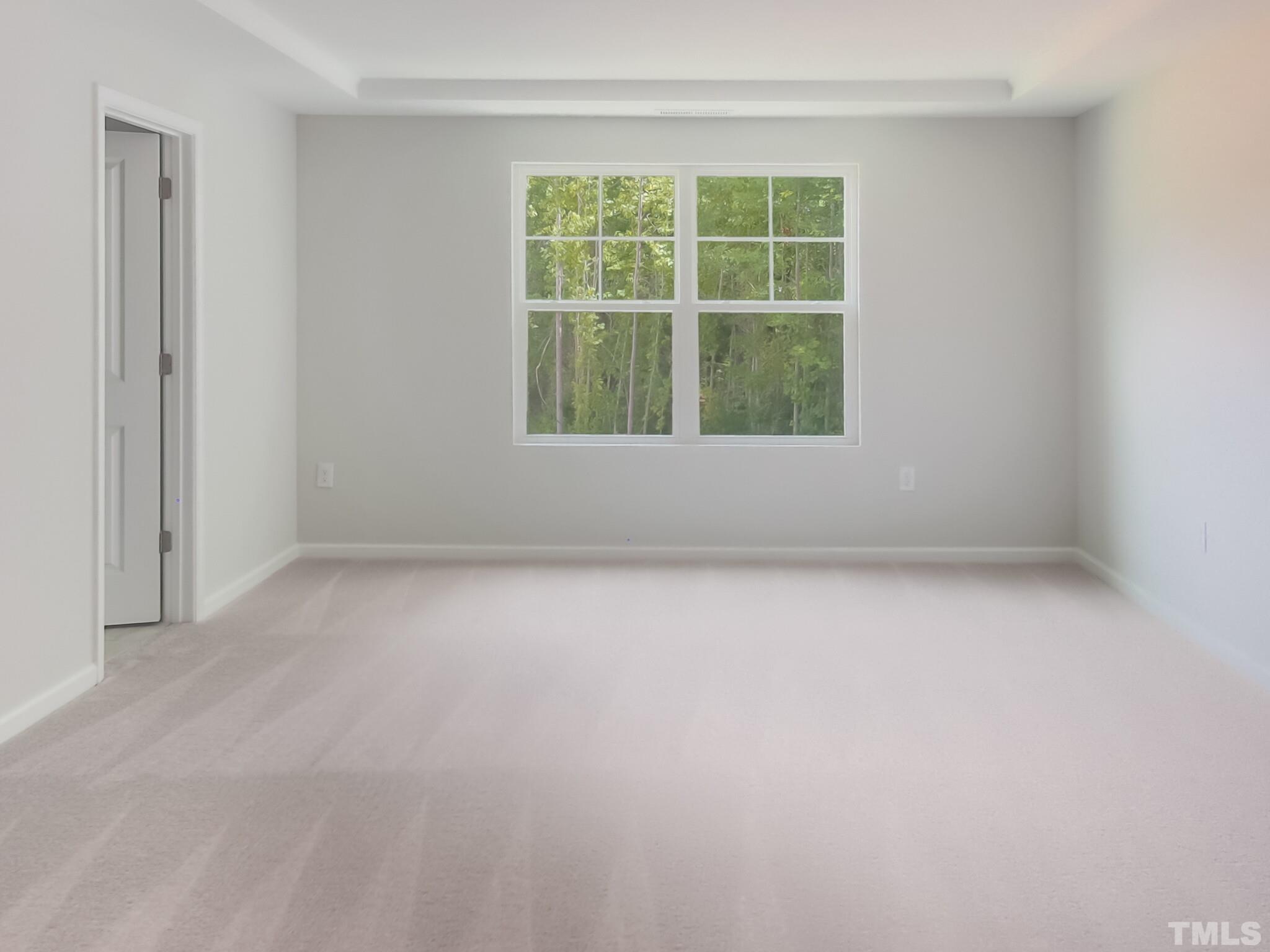 1622 Emory Ridge Way, Unit 22 Wake Forest, NC 27587 - Photo 14 of 24 an empty room with a window