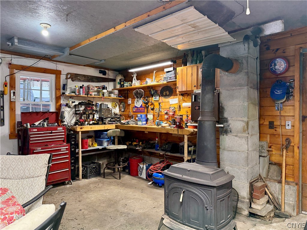 8621 Number 4 Road Watson, NY 13367 - Photo 38 of 50 wood stove / garage work bench