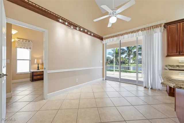 a view of a livingroom with a ceiling fan and window