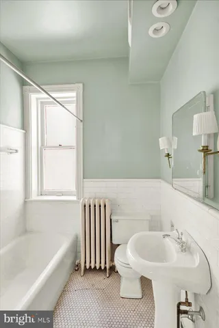 a bathroom with a sink and a bathtub
