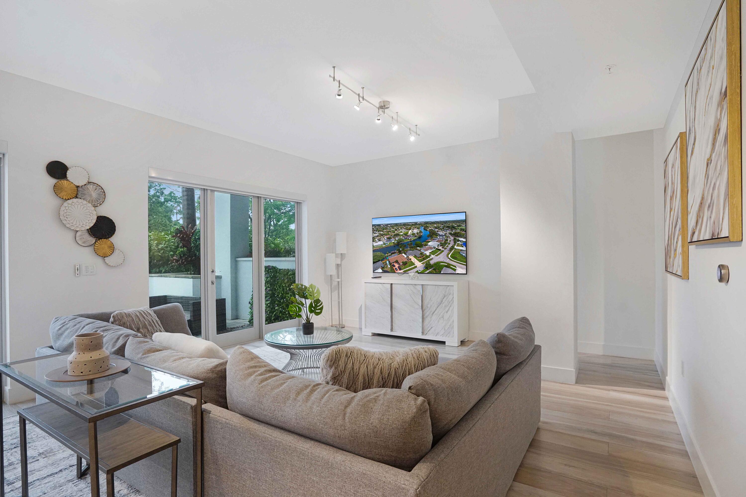 155 East Boca Raton Road, Unit TH3 Boca Raton, FL 33432 - Photo 62 of 112 a living room with furniture and a large window