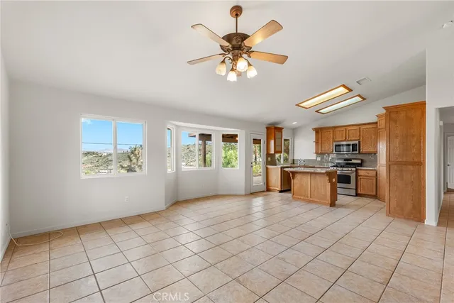a view of kitchen with furniture and window