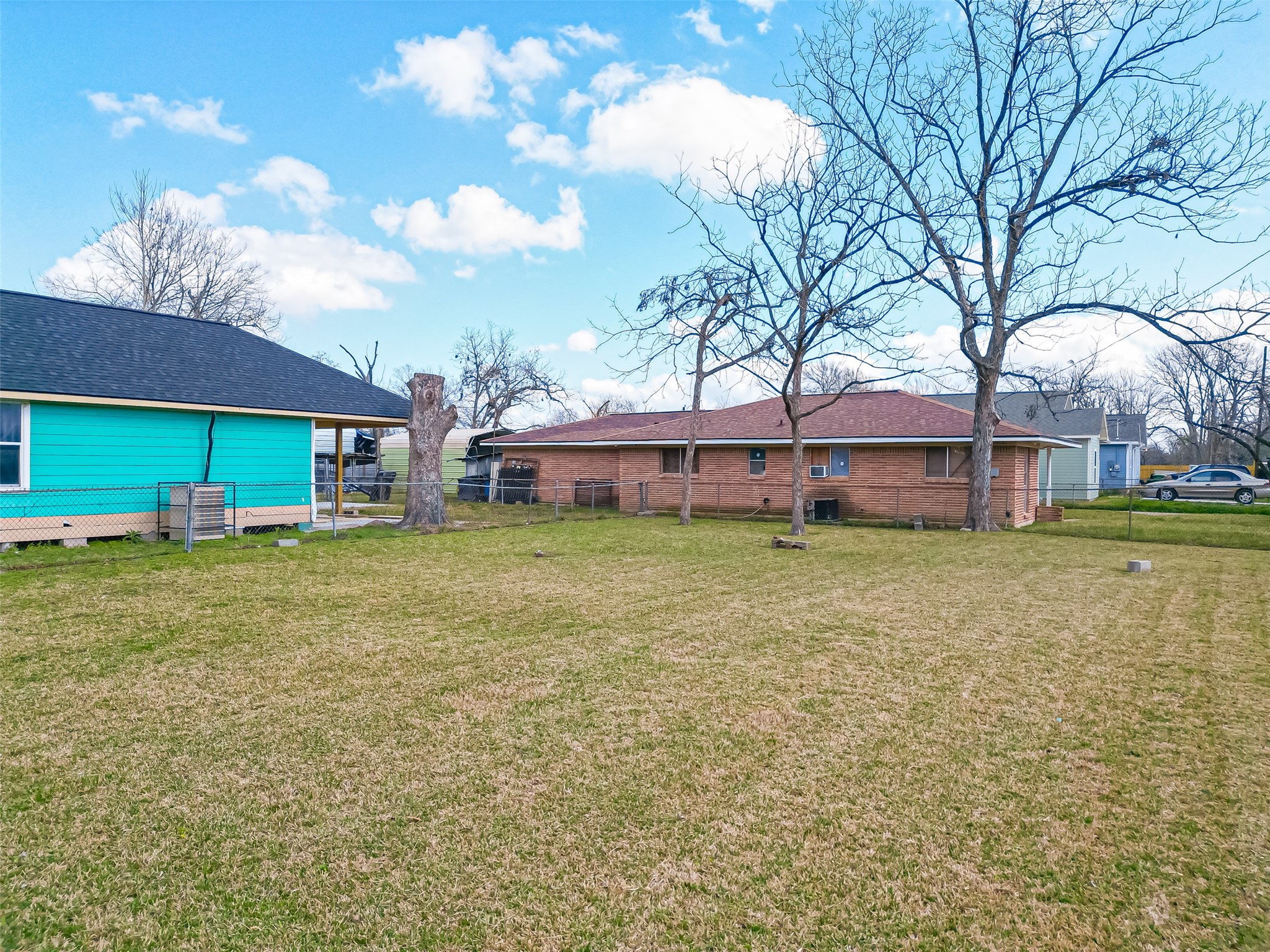 7902 Pointer Street Houston, TX 77016 - Photo 20 of 24 a front view of a house with a garden and trees