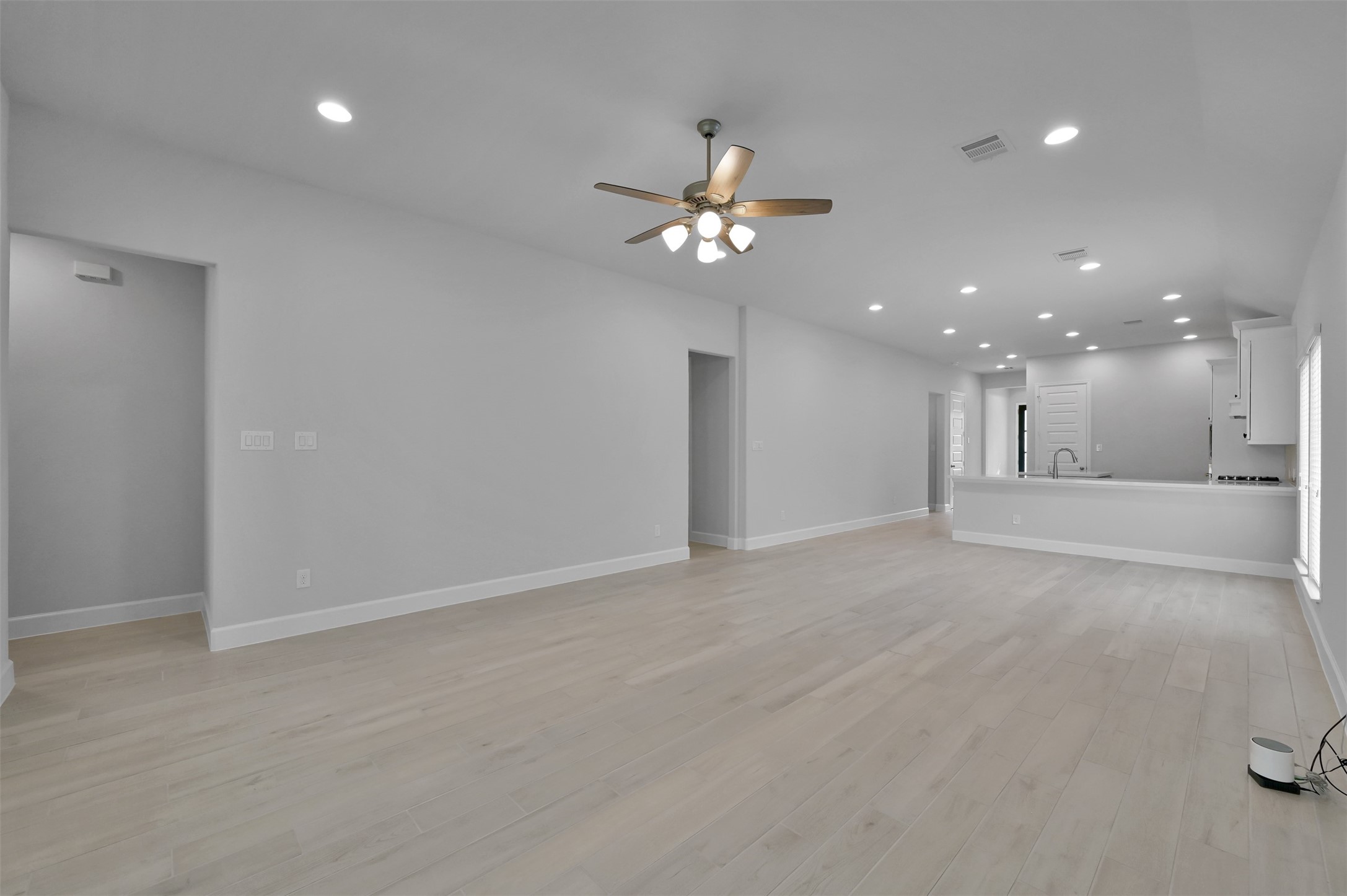 15715 Autumn Sun Conroe, TX 77302 - Photo 11 of 23 a view of an empty room with a ceiling fan