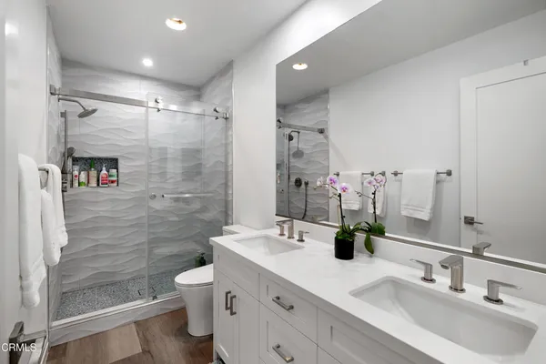 a kitchen with stainless steel appliances a sink stove and cabinets