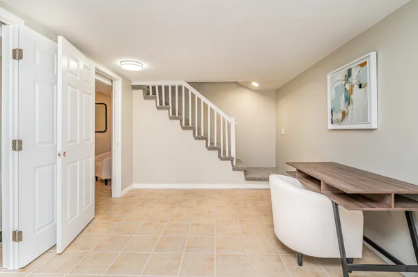 a view of a livingroom with furniture and hardwood floor