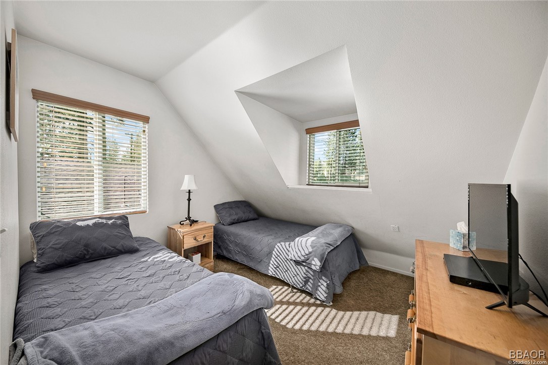 308 Eagle Drive Big Bear Lake, CA 92315 - Photo 19 of 29 a bedroom with two beds and a window