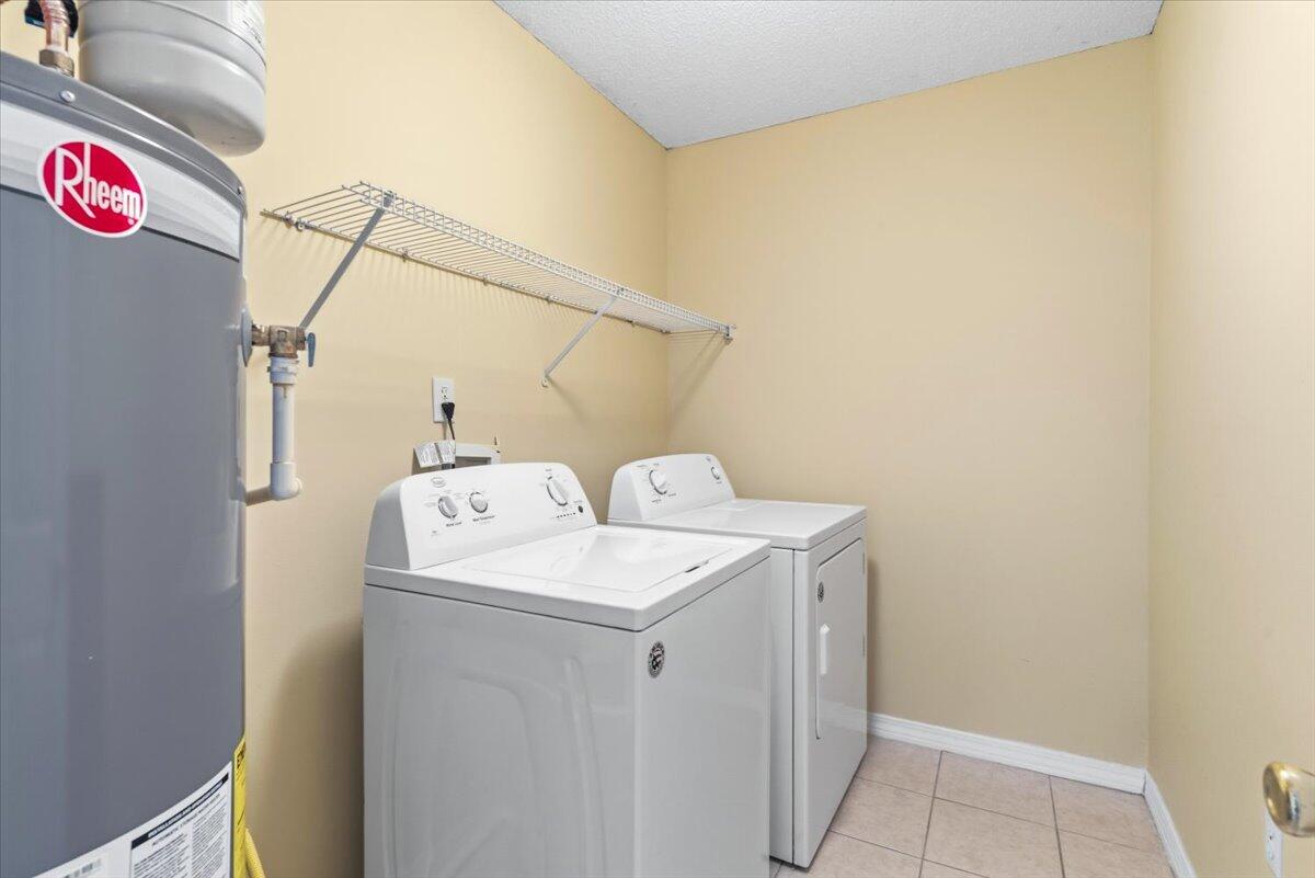 7095 Jasper Street Navarre, FL 32566 - Photo 23 of 26 a utility room with dryer and washer