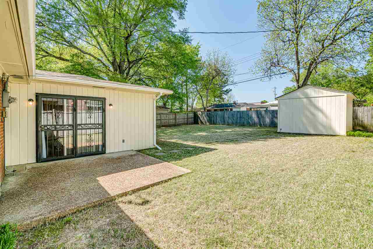 4862 Verne Road Memphis, TN 38117 - Photo 21 of 23 Spacious and fully fenced backyard with great shed/workshop.