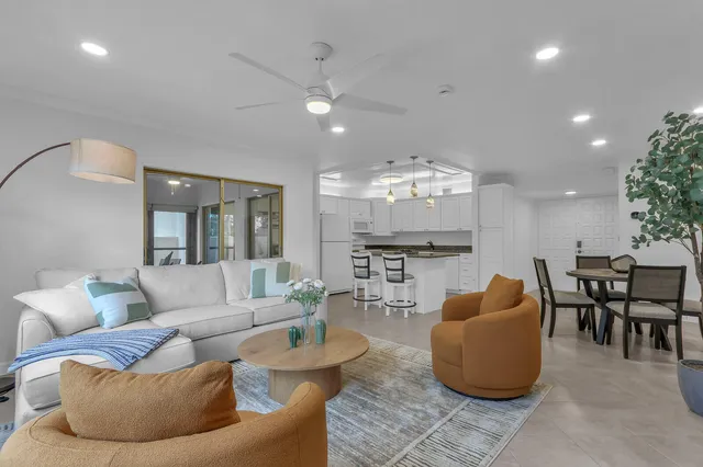 a view of a dining room with a table and chairs
