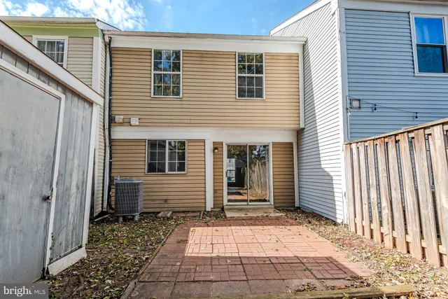 a view of house with backyard of the house