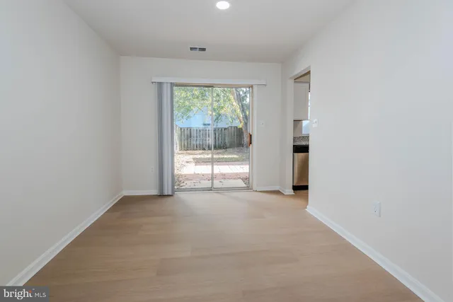 an empty room with an outdoor space