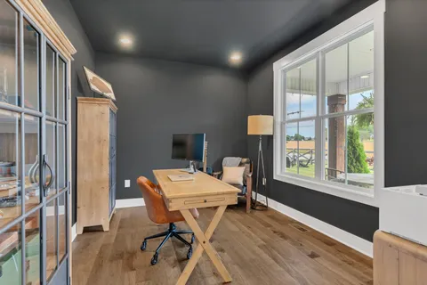 a large kitchen with stainless steel appliances granite countertop a stove a sink and a refrigerator