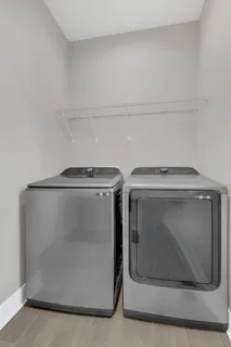 a bedroom with a bed and a chair