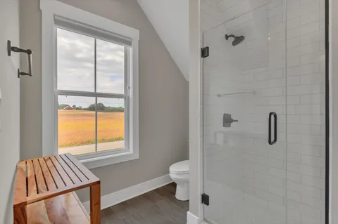 a bathroom with a granite countertop toilet a sink and a bathtub